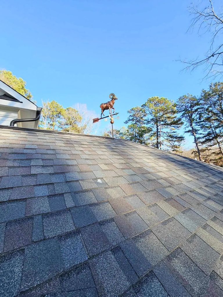 A well-maintained roof on a residential home in the Raleigh-Durham area, showing clean gutters and intact shingles