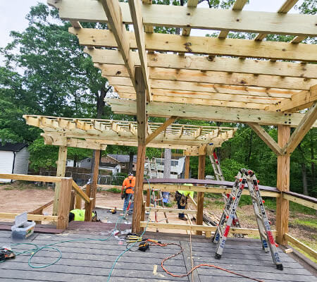 Custom-built wooden pergola providing shade in a backyard, Raleigh and surroundings areas