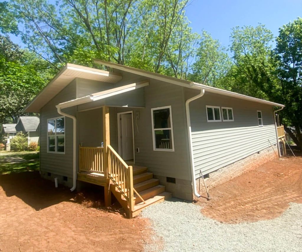 A home with newly installed gutters, featuring a sleek and modern design that complements the exterior while providing effective water management.