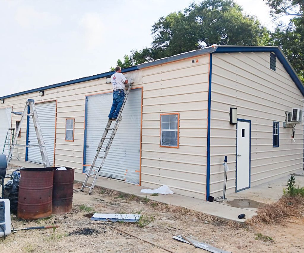 Painters at work applying a fresh coat of paint to the exterior of a home, demonstrating the various stages of the painting process.